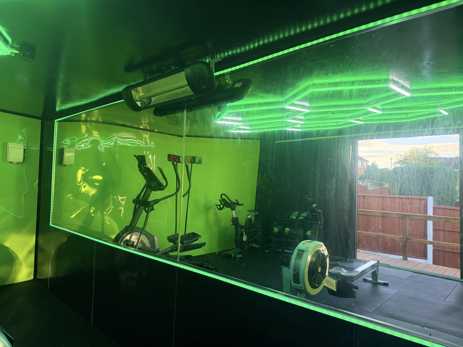 Mirrored private gym with cardio and strength equipment in Gornal